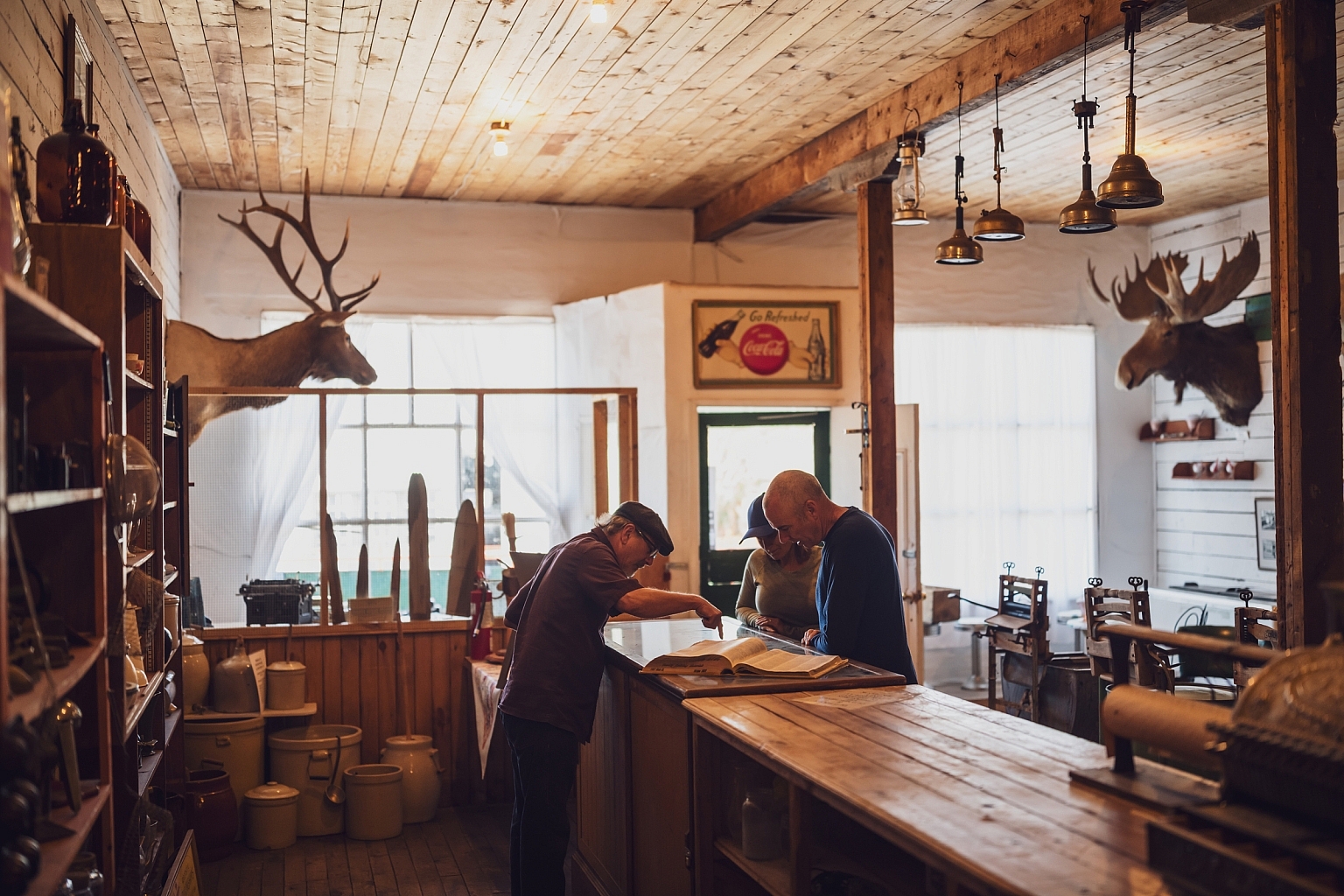 People chatting over the counter in a historic building at 